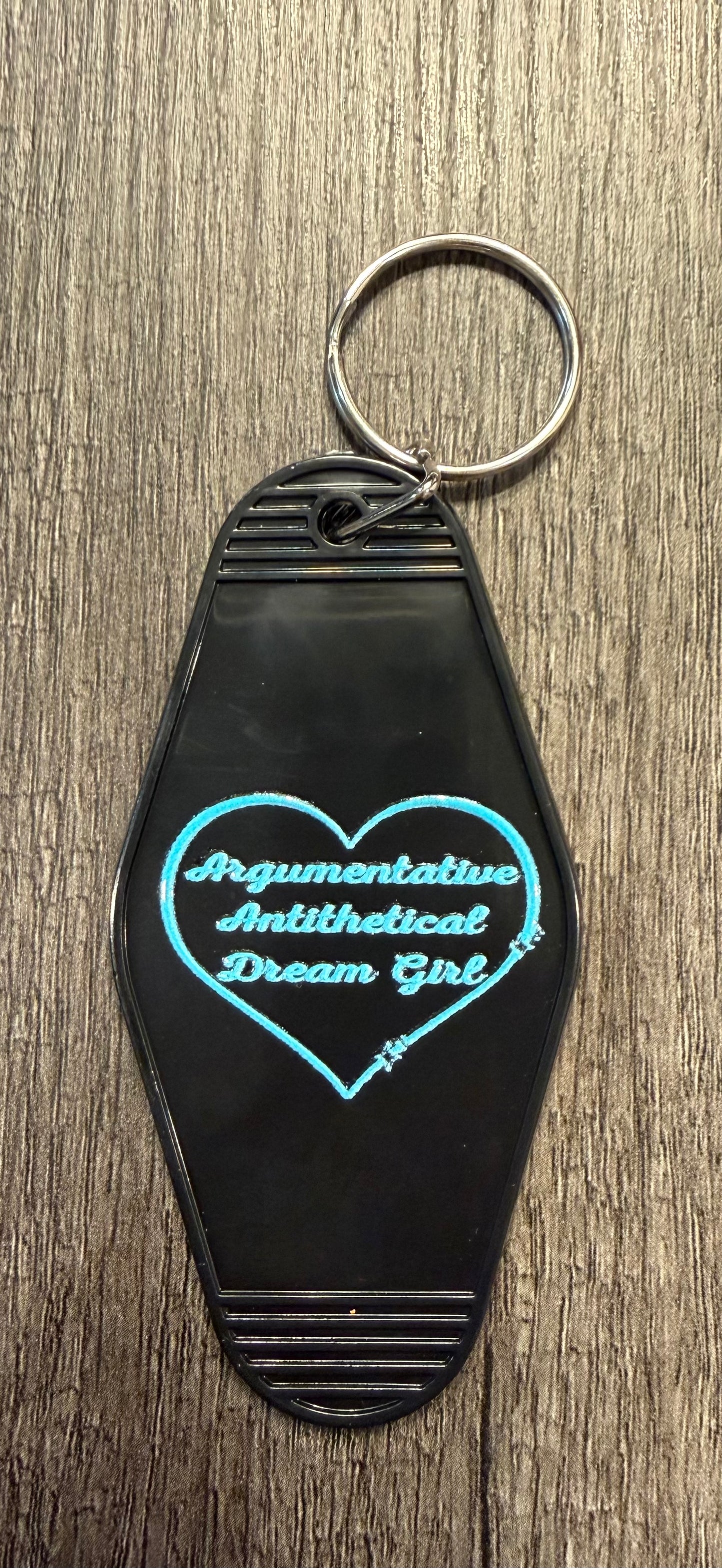 ARGUMENTATIVE ANTITHETICAL DREAMGIRL KEYCHAIN