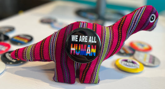 WE ARE ALL HUMAN BUTTON/MAGNET