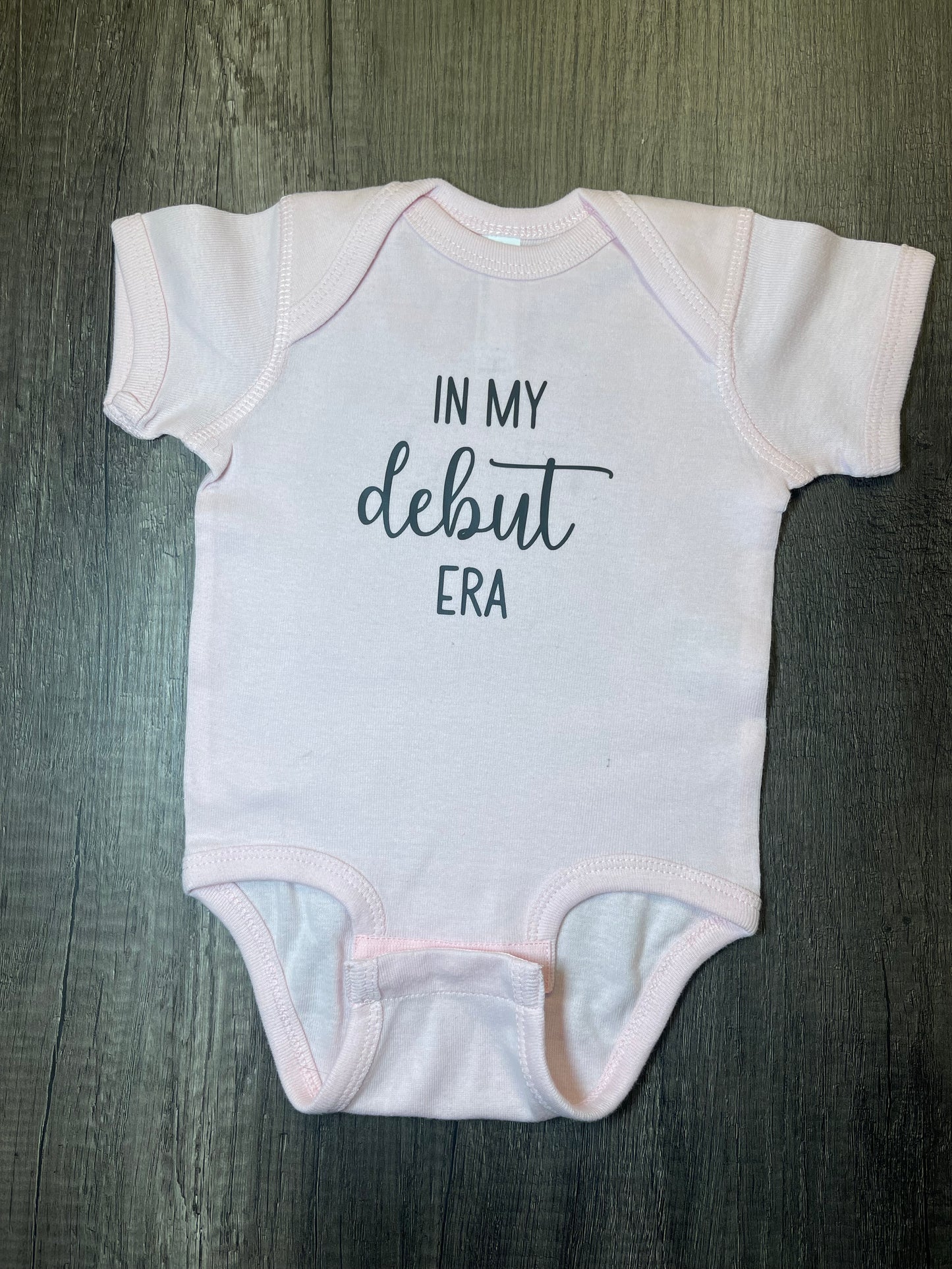 DEBUT ERA ONESIE