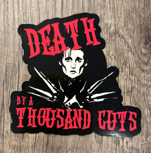 DEATH BY A THOUSAND CUTS STICKER