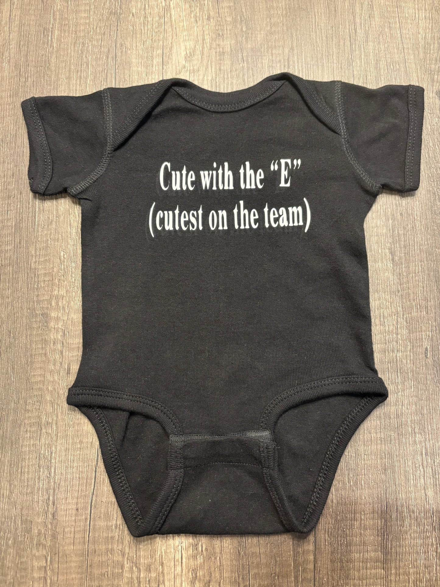 CUTE WITH THE “E” ONESIE